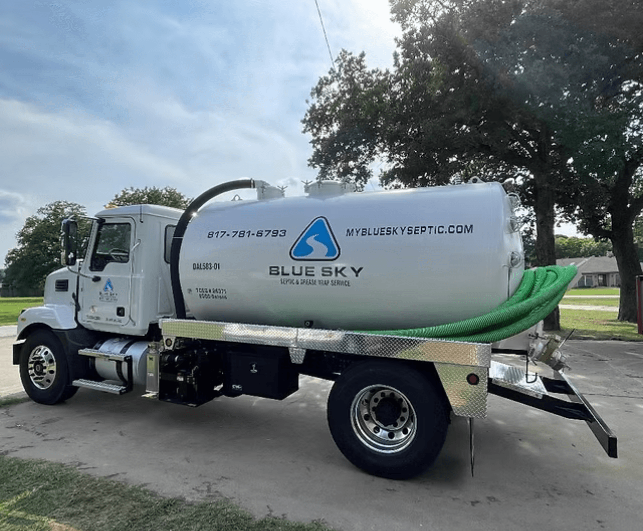 Blue Sky Septic service truck parked on a Texas property